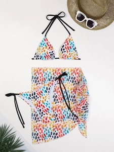 Three-piece bikini set with colorful print, mesh skirt, straw hat and sunglasses