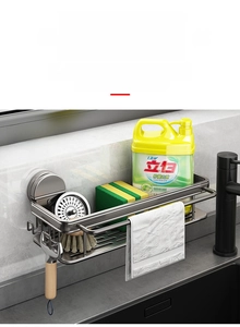 Close-up of stainless steel kitchen rack with towel bar and drainage basket installed on wall