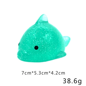 Detail showing green glitter dolphin squishy toy dimensions 7cm and weight 38.6g
