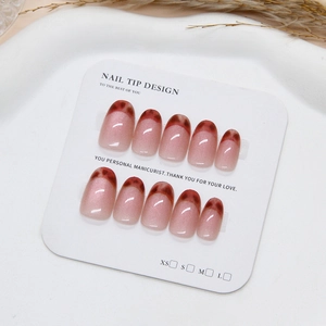 Handmade cat eye press-on nails with vintage leopard French tips on display card