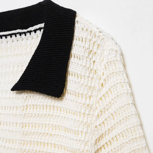 Retro knit polo top featuring a black and white color block and hollow crochet texture