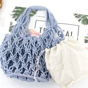 Handmade light blue woven cotton mesh tote bag with a beige drawstring inner pouch