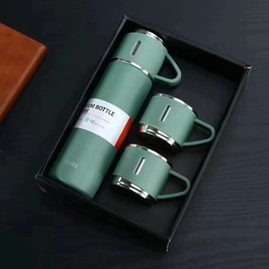 Vacuum bottle gift set with three cups in matte green finish inside a premium black box
