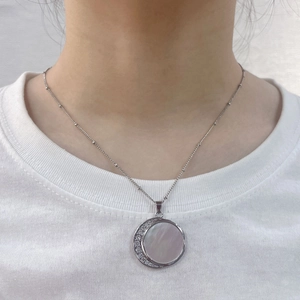 Vintage 18K gold plated sun and moon shell necklace with zircon stones on model