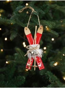 Detail of red wooden sled Christmas tree ornament with white reindeer and bells