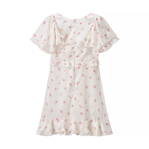 Robe à fleurs rose avec ourlet à volants et fermeture éclair invisible au dos sur blanc