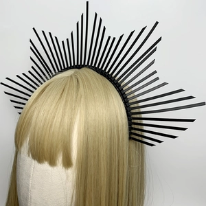 Gothic black spike sunburst halo crown headband for women on blonde model