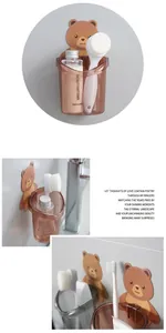 Detail of wall-mounted cartoon bear toothbrush holders on bathroom tiles for drainage