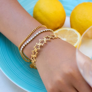 Three-piece gold stainless steel star bracelet set with rhinestones on female wrist