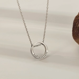 Detail of silver titanium steel ring necklace with sparkling pavé-set cubic zirconia crystals