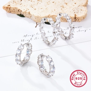 925 sterling silver hoop earrings with irregular zircon inlay on a minimalist background