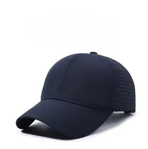 Detail of laser-cut ventilation holes on navy blue quick-dry breathable baseball cap