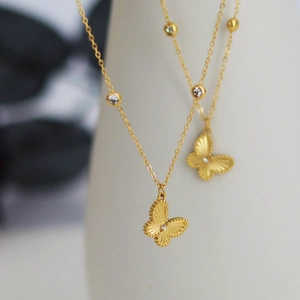 Elegant laser butterfly titanium steel necklace with gold beads and sparkling crystals