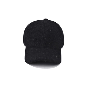 Detailed texture of black glitter knit baseball cap with warm fleece lining material