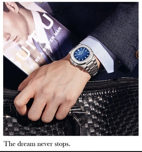 Detail of luxury men's business watch with blue textured dial and stainless steel strap