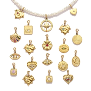 Bohemian gold plated heart moon and evil eye charms with white pearl necklace