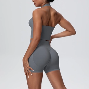 Detailed back view of charcoal yoga set showing halter top and high-waist booty shorts