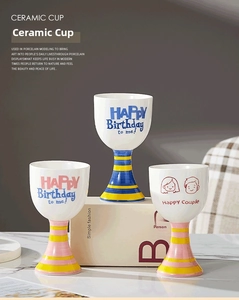 Detailed view of hand-painted ceramic dessert cups with creative birthday and couple patterns