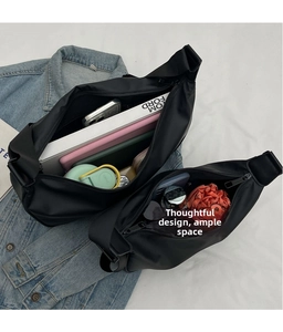 Interior view of black nylon messenger bag showing high capacity for tablets and books