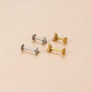 Polished stainless steel trinity stud piercings in gold and silver finish with zircon