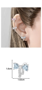 Detailed close-up of bow knot stud earring with heart zircons and 1.0cm x 1.02cm size