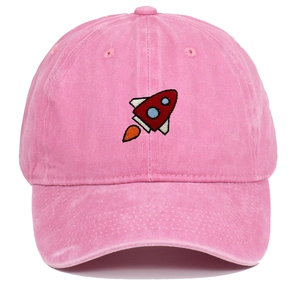 Close-up of pink washed cotton baseball cap with rocket embroidery and vintage texture