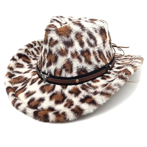 Close-up of leopard print western cowboy hat with studded leather band and metal bull head