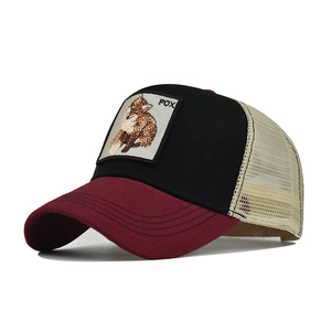 Detail of cotton mesh trucker hat with fox embroidery patch and bicolour visor