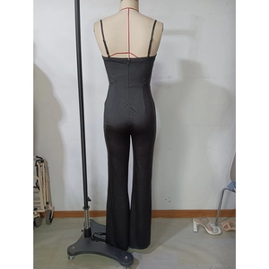 Back view of a black slim-fit jumpsuit featuring backless design and thin straps