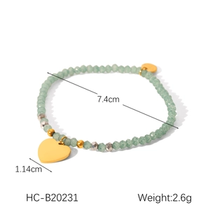 Detail view of a vintage green beaded bracelet with a heart pendant and size dimensions