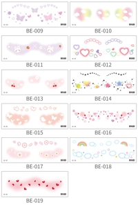 Detail view of colorful heart and butterfly face tattoo stickers for cute creative makeup