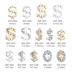 Golden and silver dollar sign metal nail art charms with luxury rhinestone accents