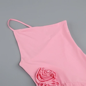 Detailed view of pink fabric with exquisite 3D rose floral appliques and silk texture