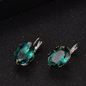 Elegant silver earrings featuring large emerald-cut oval gemstones with French hook clasps