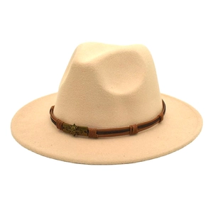Detailed view of beige wool fedora featuring a brown leather band and skull accent