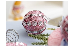 Close-up of 8cm pink foam Christmas ball with glitter, rhinestones and silver sequins