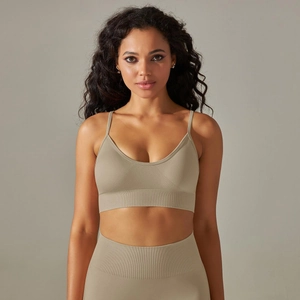 Detail of V-neck seamless sports bra with ribbed hem and high-stretch earthy green fabric