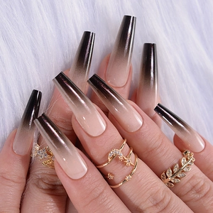 Detailed view of long coffin shape press-on nails with nude pink to black gradient finish
