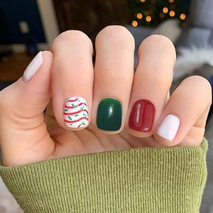 Short square Christmas press-on nails with red and green wavy lines on white base