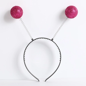 Detail of pink glitter alien antenna headband with silver springs and sequin balls