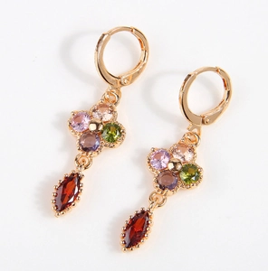 Detail of copper lever-back earrings with multi-color zircon flowers and red teardrops