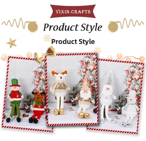 Detail view of plush Christmas dolls with sequins featuring Santa, snowman and elk designs