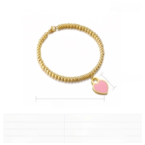 Detail of 18k gold plated beaded bracelet with pink heart resin charm showing size specs