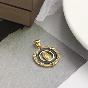 Golden Virgin Mary pendant with black enamel inlay and sparkling zircon stones