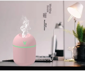 Pink portable mini USB humidifier with colorful LED light and fine mist for office desktop