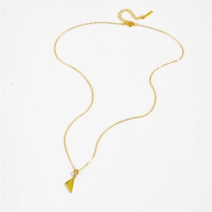 Macro shot of S925 sterling silver gold-plated triangle pendant necklace with zircon stones