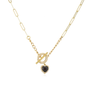 Close-up of gold-plated OT clasp with heart pendant and sparkling pavé crystal details