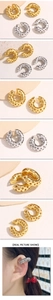 Detailed close-up of C-shaped ear cuffs featuring hollow star patterns in gold and silver