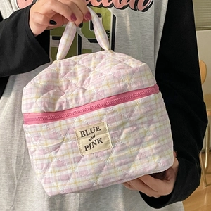 Pink and yellow quilted checkered makeup bag with top handle and secure zipper closure