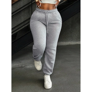 Close-up of dark grey joggers featuring adjustable drawstring waist and elastic cuffs